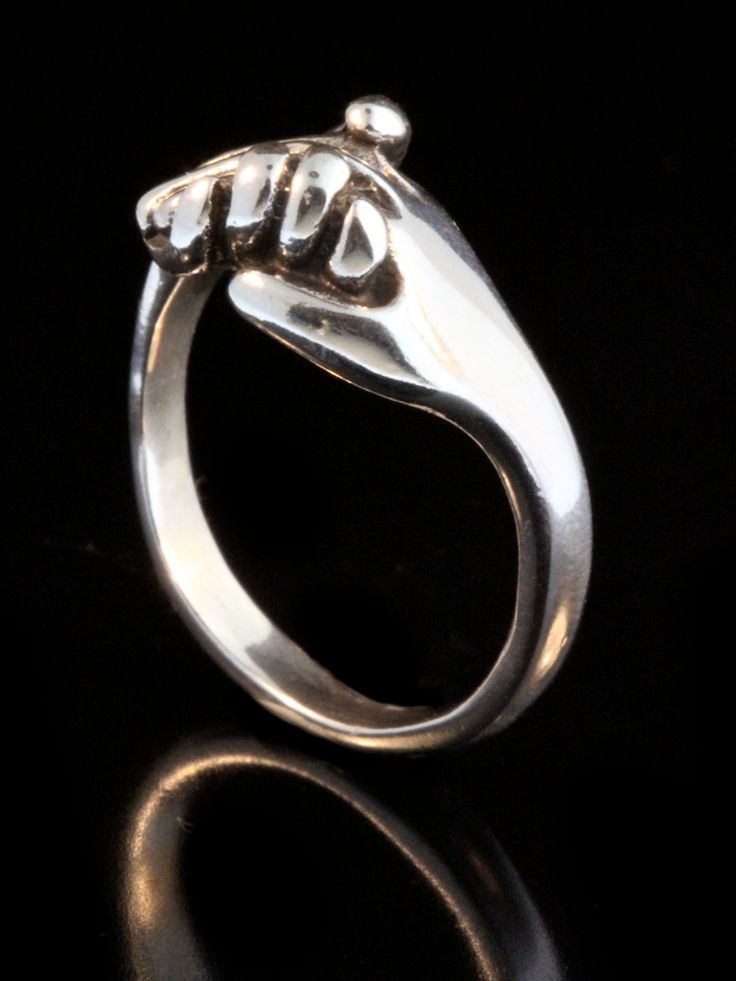 This solid sterling silver clasping Hand Ring is a classic and is beautifully executed. This design is a symbol of love, friendship, support and solidarity. We have many ring sizes immediately available. We will contact you to let you know if we have your chosen ring size in stock or when to expect shipment. All Marty Magic Jewelry is packaged in a beautiful box embossed with the gold foil Marty Magic dragon logo. Perfect for any occasion! Designed in California by Marty Magic. Made in the U.S.A Symbolic Promise Jewelry With Polished Finish, Sterling Silver Rings With Polished Finish For Gift, Symbolic Open Ring Jewelry With Polished Finish, Symbolic Sterling Silver Promise Jewelry, Symbolic Sterling Silver Engraved Ring With Polished Finish, Symbolic Sterling Silver Rings With Polished Finish, Symbolic Open Ring With Polished Finish, Symbolic White Gold Jewelry For Promise, Symbolic White Gold Promise Jewelry