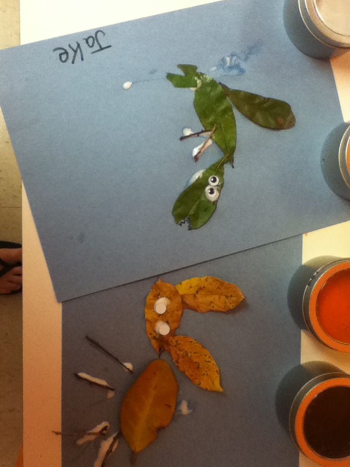 the paper is cut out to look like leaves and other things are on the table