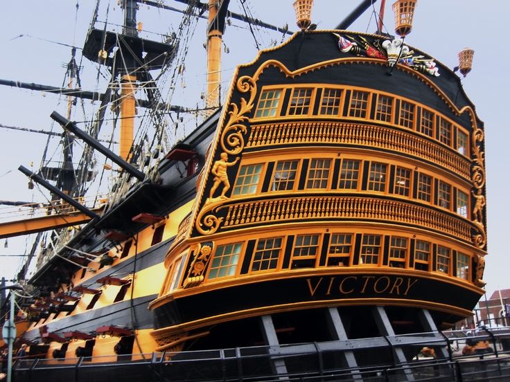 a large yellow and black boat with lots of windows