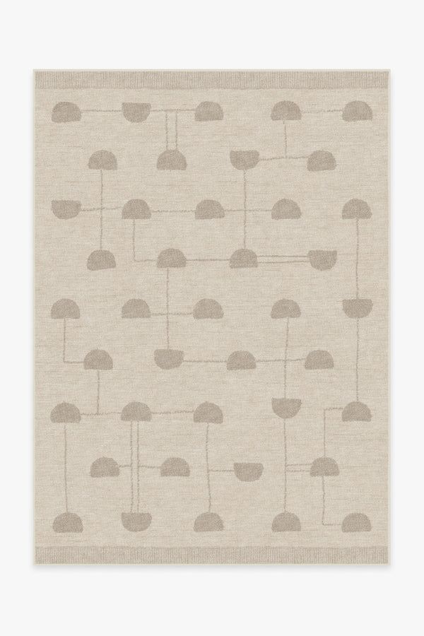 a beige and grey wallpaper with small trees on the side, in shades of gray