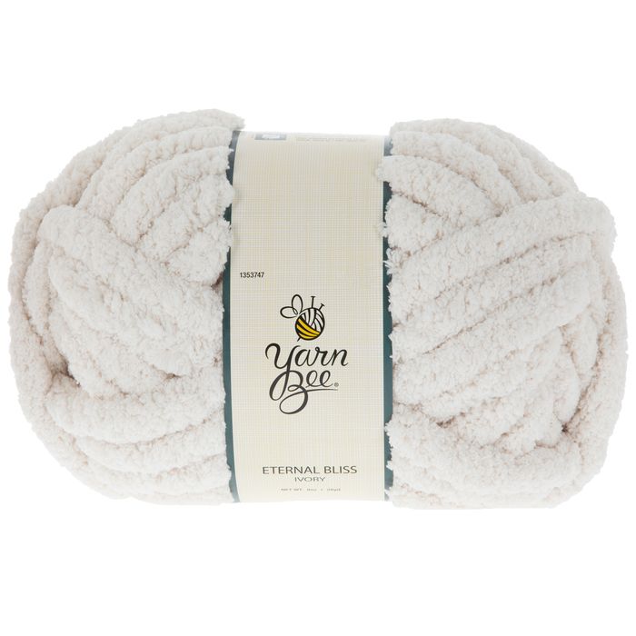 yarn ball in white with the label for yarn bee on it's front end