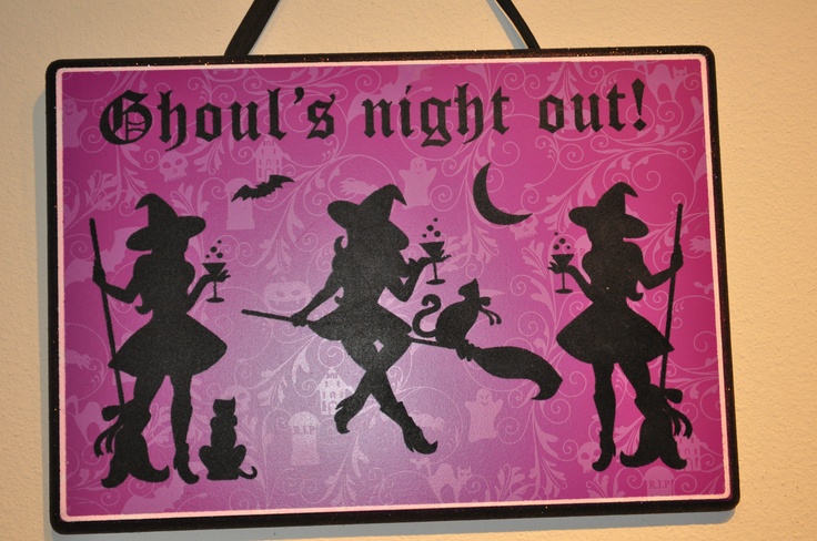 a sign that says,'thou's night out'with silhouettes of witches