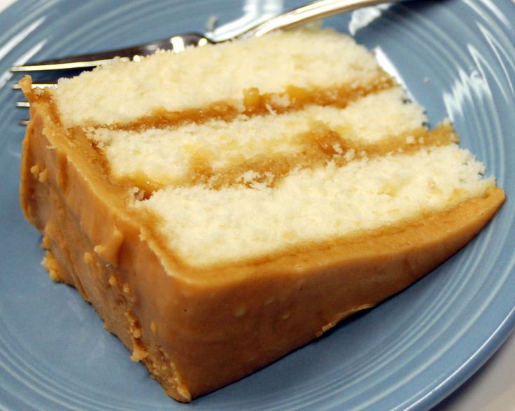 a piece of cake on a blue plate with a fork