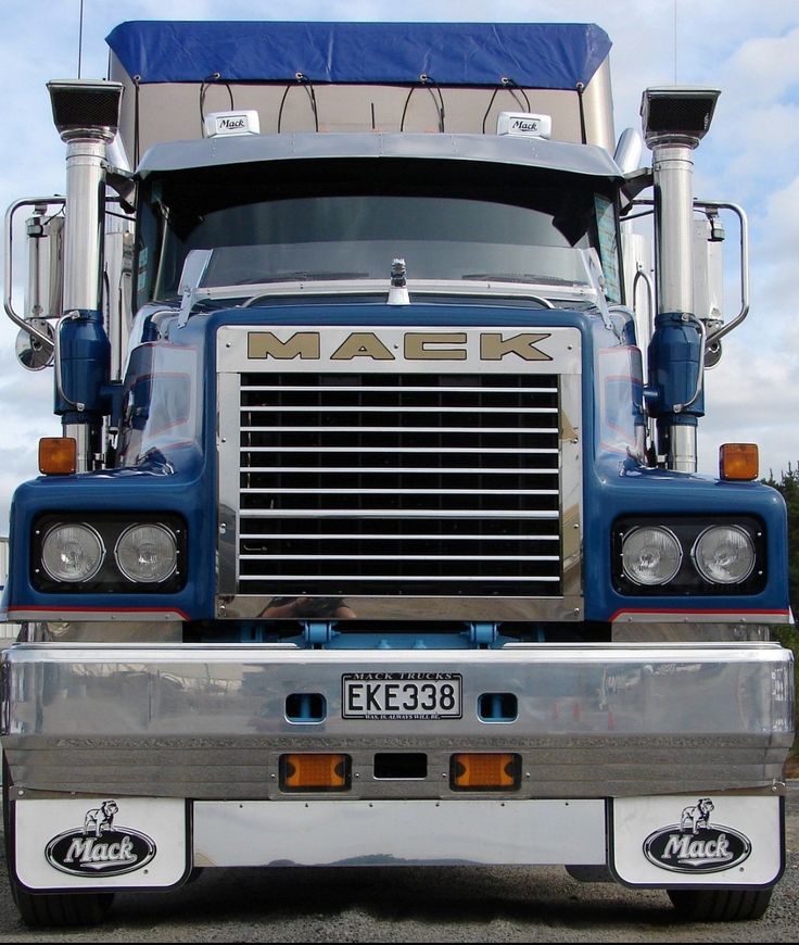 the front end of a blue mack truck