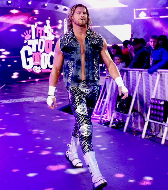 the wrestler is walking down the runway