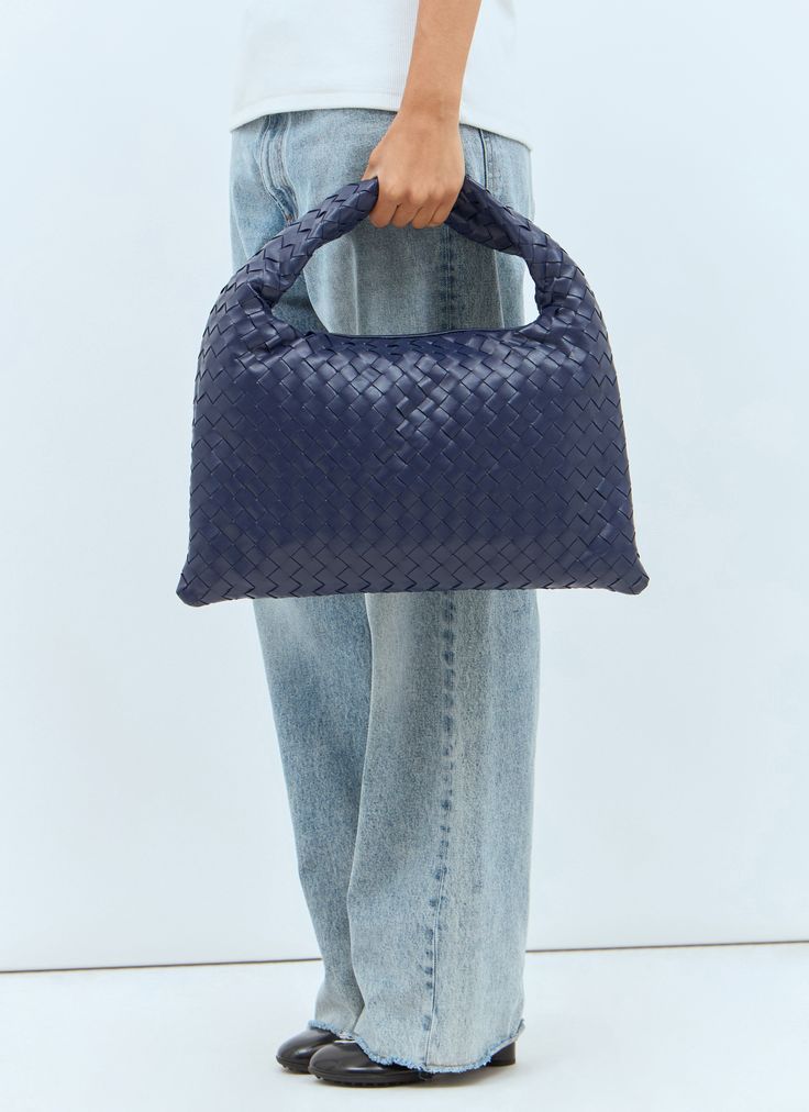 Small Hop shoulder bag in Intrecciato woven leather. Top handle Interior magnetic fastening Intrecciato weave One main compartment Interior zip pocket Made in Italy 100% Leather Color: Navy Code: 796262 V3IV1 4527 SKU: bov0257060blu Our Products Are 100% Genuine. In All Cases We Stand By The Authenticity Of Every Product Sold On Our Site. Handheld Shoulder Bag With Intrecciato Weave For Travel, Blue Leather Shoulder Bag With Woven Detail, Blue Woven Leather Bag, Blue Woven Leather Bags For Daily Use, Blue Woven Leather Bag For Everyday Use, Luxury Blue Shoulder Bag With Braided Handles, Modern Blue Woven Leather Bag, Blue Top Handle Bag With Intrecciato Weave, Chic Blue Bag With Intrecciato Weave