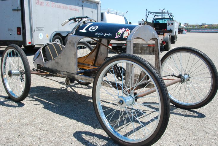 an old fashioned car is parked in the parking lot