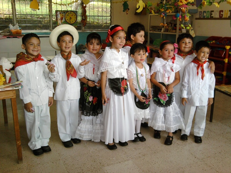 a group of children standing next to each other