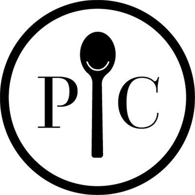 a black and white photo of a microphone in a circle with the words pcc on it