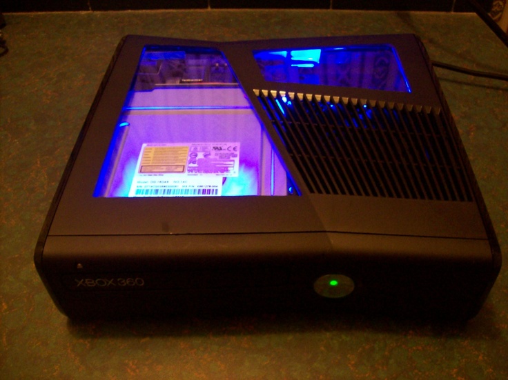 the electronic device is lit up with blue lights on it's display case,