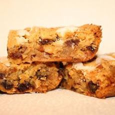 three pieces of fruit and nut bars stacked on top of each other