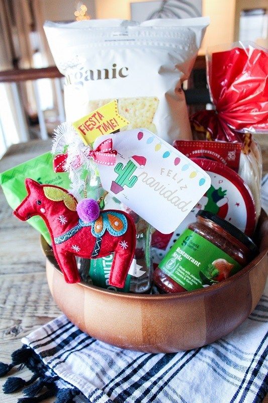 a wooden bowl filled with candy and candies