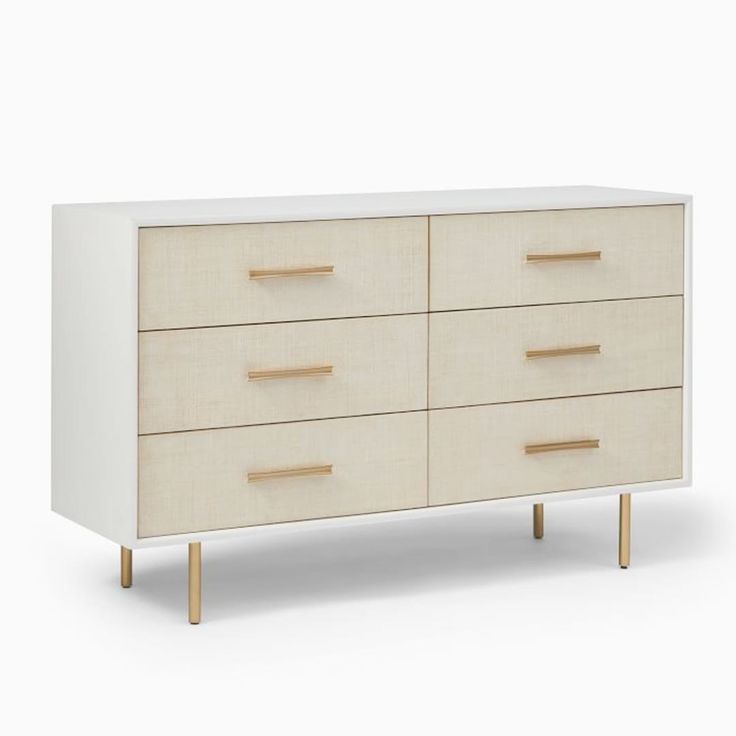 a white and wood dresser with four drawers