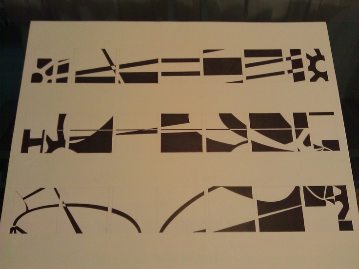 several black and white designs on a piece of paper