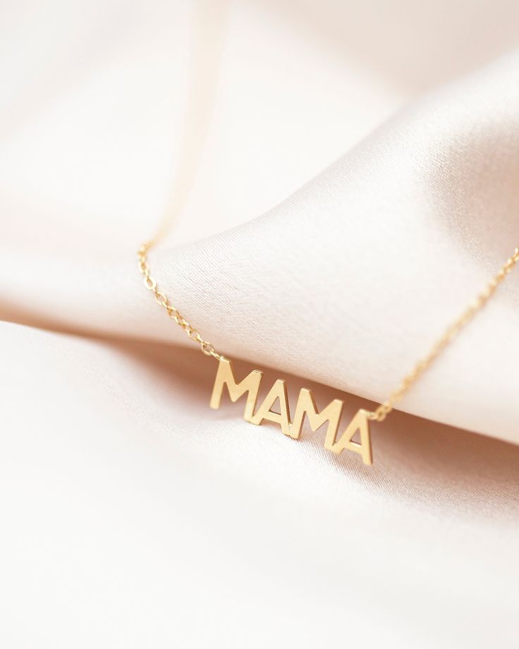 In celebration of all the great mothers around the world, treat the mom in your life to this piece of jewelry they deserve with this gold mama necklace. A perfect way to express what means most to you! Available in 14K yellow, rose or white gold Letters measure about 5mm in height Necklace total length is measured from end to end Dainty minimalist everyday necklace 14k Yellow Gold Name Necklace For Mom, Mother's Day 14k Gold Birthstone Charm Necklace, Meaningful Hallmark Jewelry For Mother's Day, Delicate Yellow Gold Necklaces For Mother's Day, Delicate Yellow Gold Necklace For Mother's Day, Mother's Day Nameplate Birthstone Necklace, Minimalist Birthstone Necklaces For Mother's Day, Delicate Yellow Gold Name Necklace For Mother's Day, Meaningful Charm Necklaces For Mom As Gift