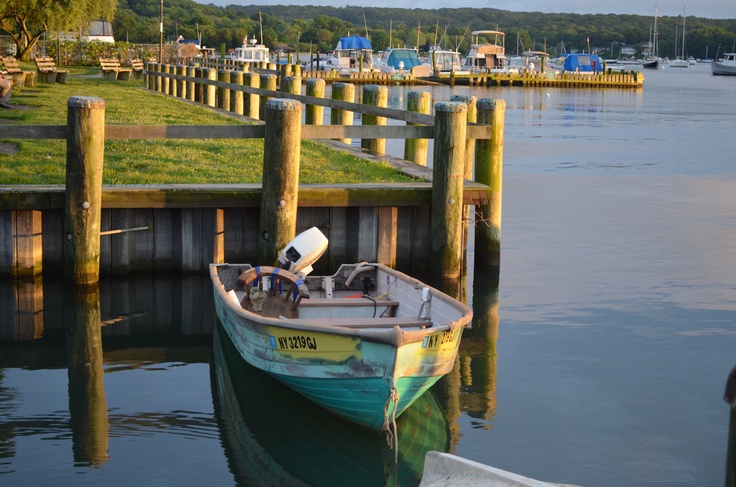 a small boat is docked at the dock