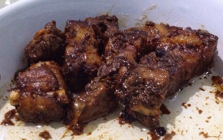 some food is in a white bowl on the table and it looks like they have been cooked