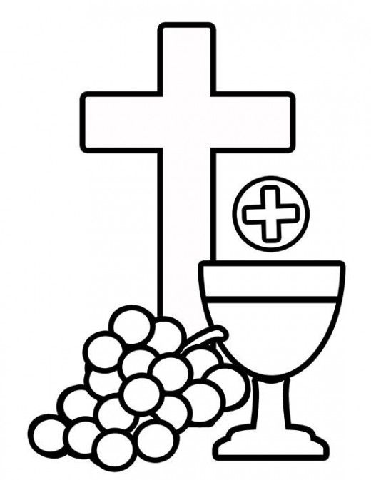 a cross, a wine glass and grapes on a table