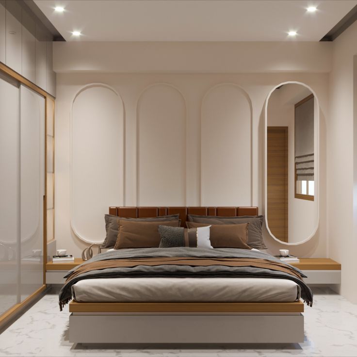 a large bed sitting in the middle of a bedroom next to a closet and mirror