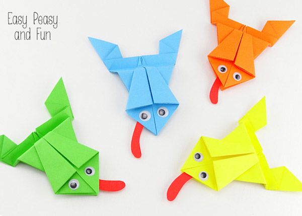 four origami fish made out of colored paper