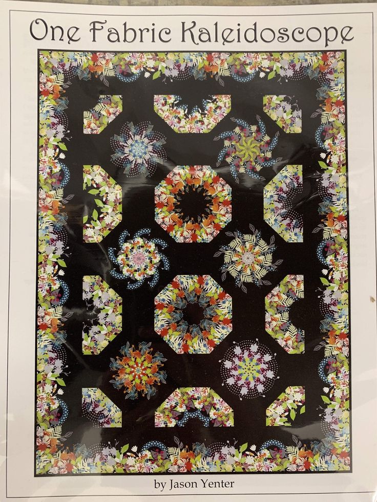 the cover of one fabric kaleidoscope by jason venter, featuring an image of flowers