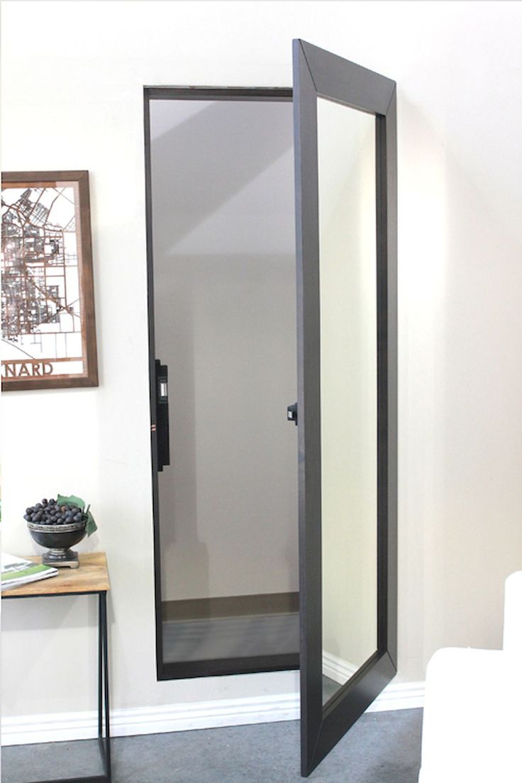 the mirror closet door is in place of a standard door to hide the toilet paper