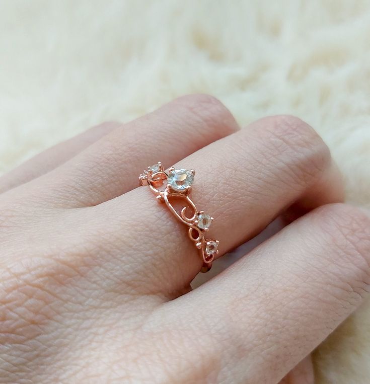 A romantic and feminine princess ring with delicate details, perfect gift for your little princess! Stone: Nature white Topaz in 4mm & 2.2mm. Bandwidth: 1.1mm Metal: 14k rose gold plated sterling silver base Delicate Crystal Ring For Anniversary, Delicate Anniversary Crystal Ring, Dainty Rose Gold Jewelry For Proposal, Delicate Rose Gold Promise Rings, Delicate Rose Gold Crystal Wedding Ring, Cubic Zirconia Rose Gold Birthstone Ring For Promise, Delicate Rose Gold Crystal Ring For Wedding, Delicate Rose Gold Flower Ring For Promise, Delicate Rose Gold Jewelry For Proposal