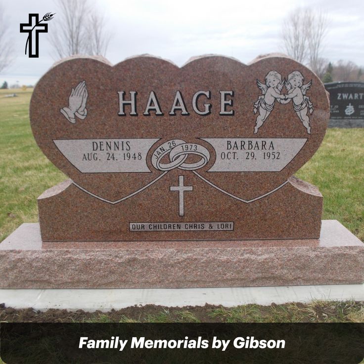 the headstone of two people in front of a heart - shaped stone with an angel on it