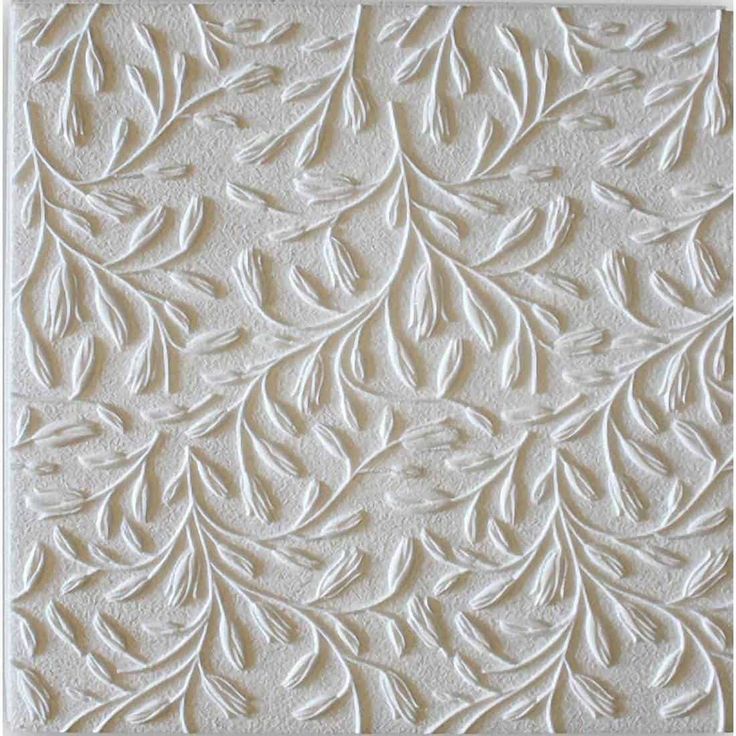 an image of a white textured wallpaper with leaves and flowers on the surface