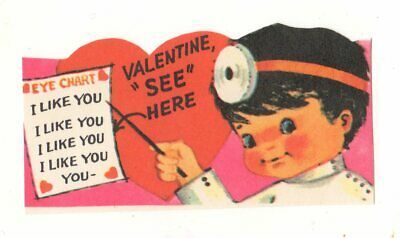 an old valentine card with a child holding a heart