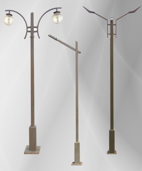 three different street lamps with one light on each pole