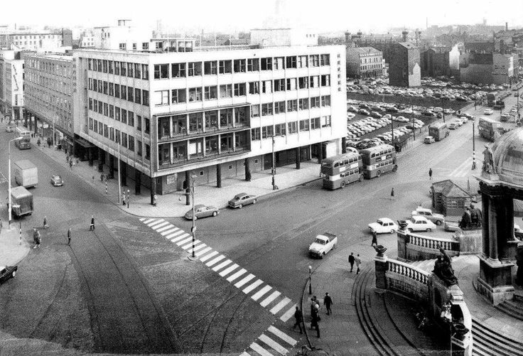 an old black and white photo of a city street