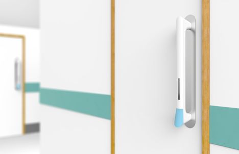 a door handle on the side of a white cabinet with green stripes and blue trim