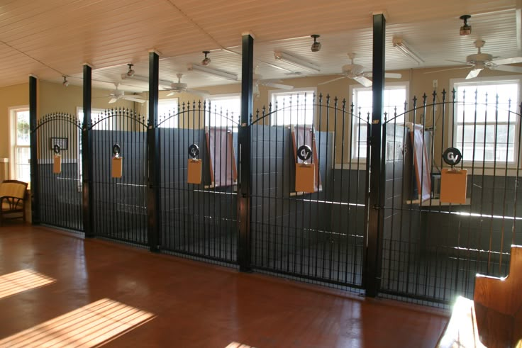 a room with several gates and chairs in it