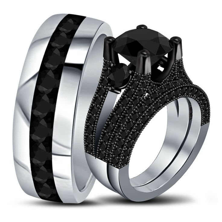 two wedding rings with black diamonds on each one and the other in white gold or silver