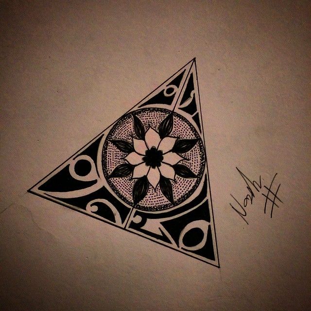 a drawing of a triangle with a flower on it