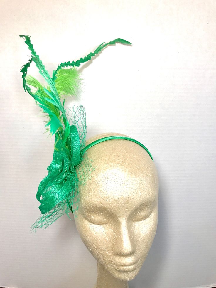 "Sinamay Fascinator with feathers attaches with hair comb. Style: The Ellie Rose ♥Attaches with hair comb which allows you to place the piece as you like. ♥Ultra Light & comfortable to wear. ♥Packed and shipped in a sturdy box with special love & care to ensure a safe delivery. ♥Includes a hat care card with instructions on how to care for & keep your piece beautiful. ♥Over 14,000 pieces sold & 2,000 5 star reviews. Our \"Hive Girls\" come back year after year for their next hat Whimsical Green Headpiece For Parties, Green Feathered Mini Hat For Wedding, Green Mini Hat With Feathers For Wedding, Green Spring Headband Hair Accessories, Adjustable Green Hair Accessories For Spring, Green Headband Hair Accessories For Spring, Spring Party Feather Trim Fascinator, Green Summer Headpieces For Party, Elegant Green Feathered Headpieces