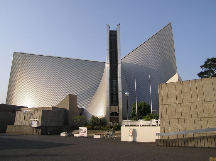 a large building sitting next to a parking lot