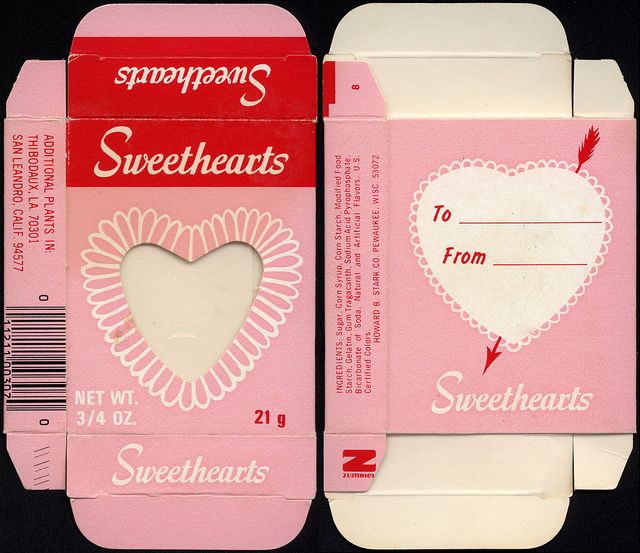 two pink and white envelopes with heart shaped paper on the front, and back