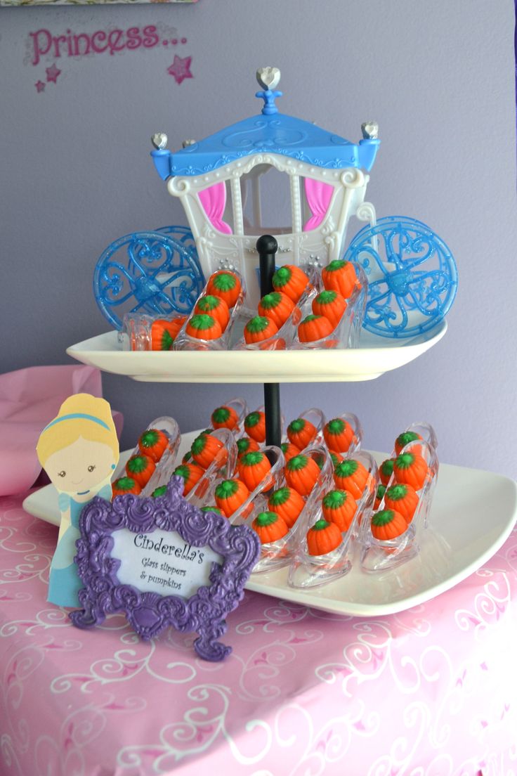 there are carrots on the plate and cupcakes in plastic wrappers