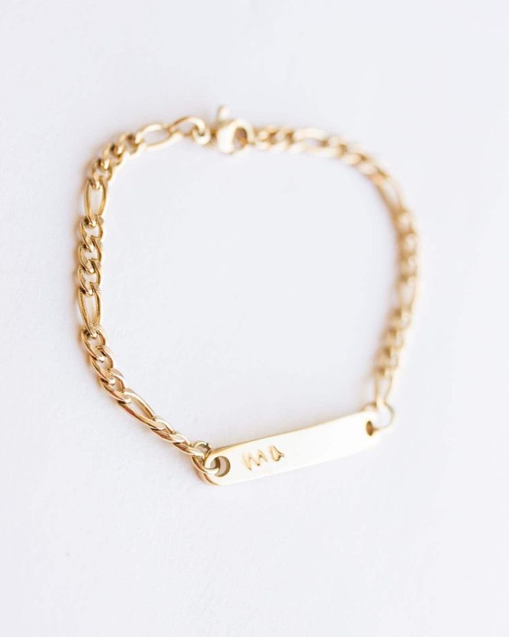 Personalized Children's bracelet in 14k gold over stainless steel. A lovely christening gift. Also cute as a baby gift. The bar measures 3 cm / 1.18 inches and the bracelet can be made at any size to 16 cm / 6.3 inches. It is nickel, lead free and it is hypoallergenic. It is not going to tarnish or change color. * ADD a gemstone on your bracelet: http://etsy.me/2naJrV4 * ADD an evil eye on your bracelet: http://etsy.me/2ocLyYT * ADD a cross or a clover or an infinity charm on your bracelet as yo Gold Chain Bracelet For Mother's Day, Adjustable Everyday Gold Bracelet For Mother's Day, Gold Custom Name Charm Bracelet For Friendship, Gold Charm Bracelet With Custom Name For Friendship, Classic Gold Jewelry For Friendship, Personalized 14k Gold Bracelet For Everyday, Personalized 14k Gold Hypoallergenic Bracelets, Classic Personalized Jewelry For Friendship, Adjustable Yellow Gold Name Jewelry