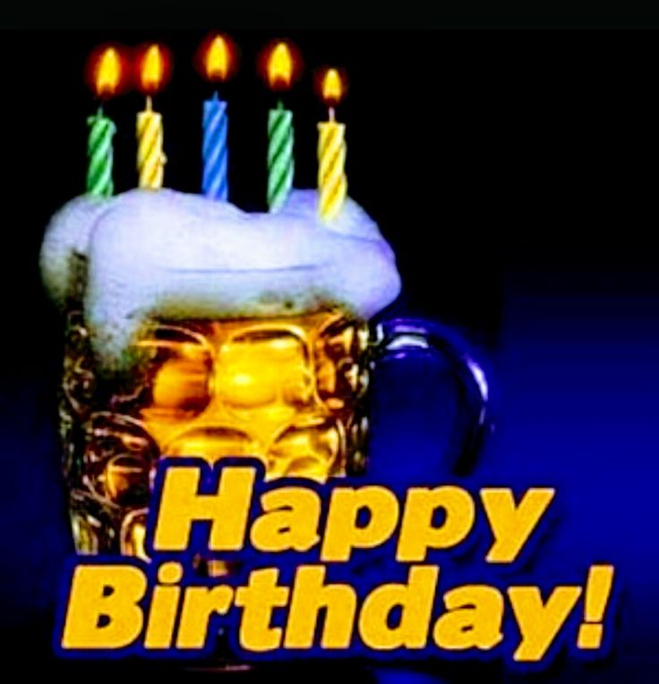 a beer mug with candles on it and the words happy birthday in front of it