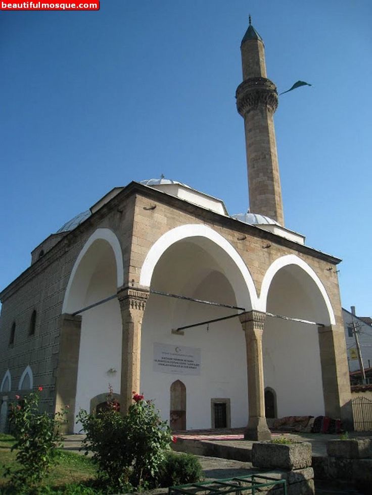 an old building with a tall tower in the middle of it's courtyards