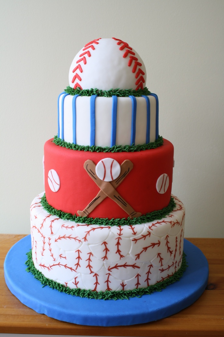 a three tiered cake decorated with baseballs, bats and balls on top of it