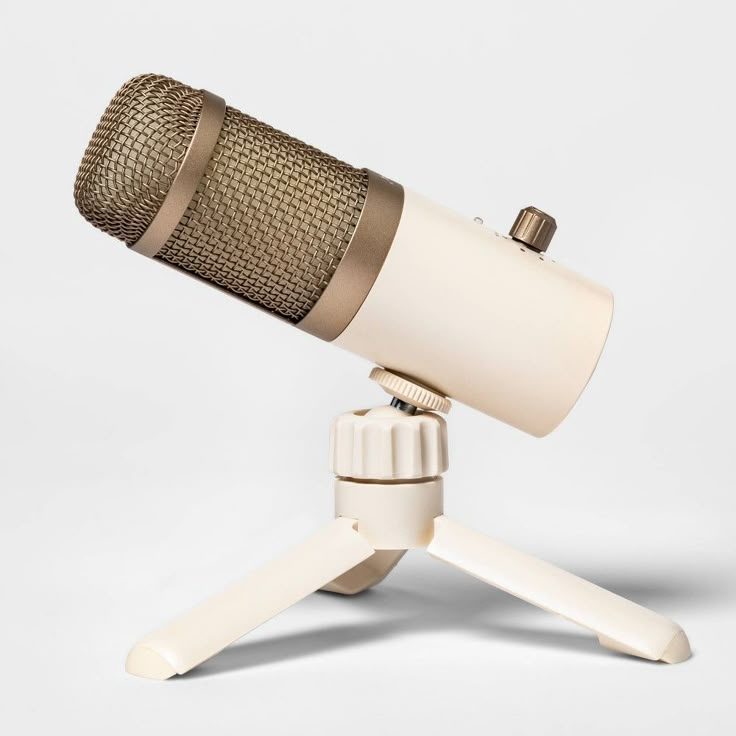 an old fashioned microphone on a tripod with a white background and no one around it