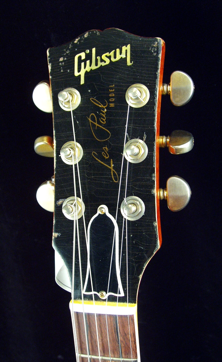 an old guitar neck with the headstock showing