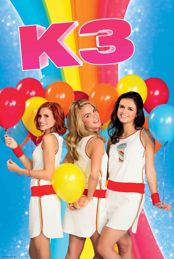 the k - 3 girls are posing with balloons and streamers