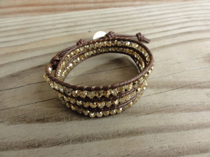 "This gorgeous wrap bracelet features 4mm faceted gold firepolished czech glass beads strung between 2mm brown genuine leather cord. An antiqued gold celic knot button provides the closure in one of two loops. When wrapped three times, this bracelet measures about 1 inch wide. ---------------------------------------------------------------------------------------------------------------------------- Sizing Information: To ensure you order the correct size bracelet, measure snug around your wrist Adjustable Brown Wrap Bracelet Nickel Free, Adjustable Nickel-free Brown Wrap Bracelet, Adjustable Brown Nickel-free Wrap Bracelet, Adjustable Brown Bracelets For Party, Adjustable Brown Bracelet With Faceted Beads, Adjustable Brown Bracelets With Faceted Beads, Adjustable Brown Jewelry With Gold Beads, Adjustable Gold Leather Bracelet For Party, Adjustable Brown Leather Bracelet For Party