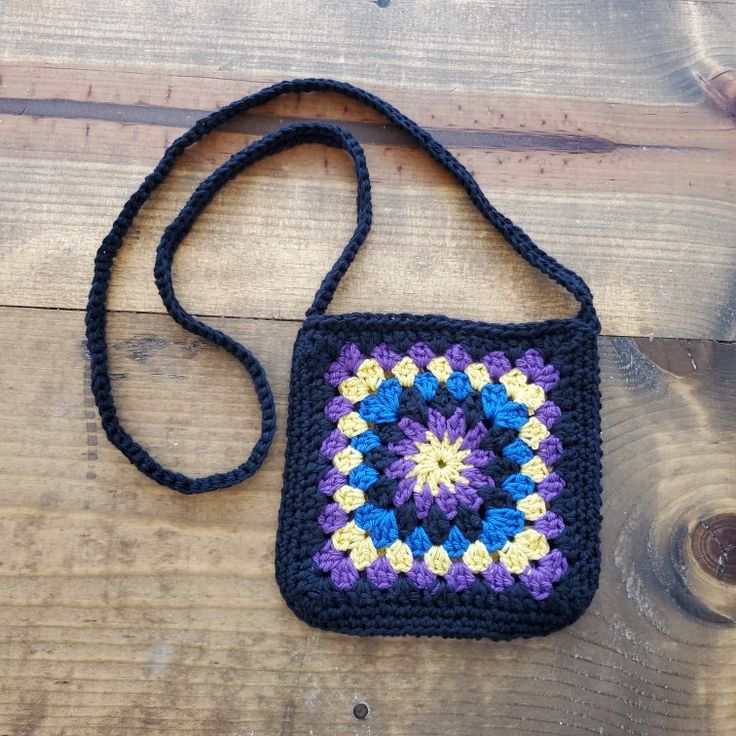 Not your grandma's granny square bag. This bag is filly lined. 7.5" Perfect size for your phone, sunglasses and keys. #grannysquare #bohochic #crochetproject #crochet #crochetbag Handmade Cotton Crossbody Shoulder Bag, Granny Square Crochet Purse, Cross Body Bag Crochet, Body Bag Crochet, Boho Granny Square, Boho Cross, Granny Square Bag, Crochet Purse, Square Crochet