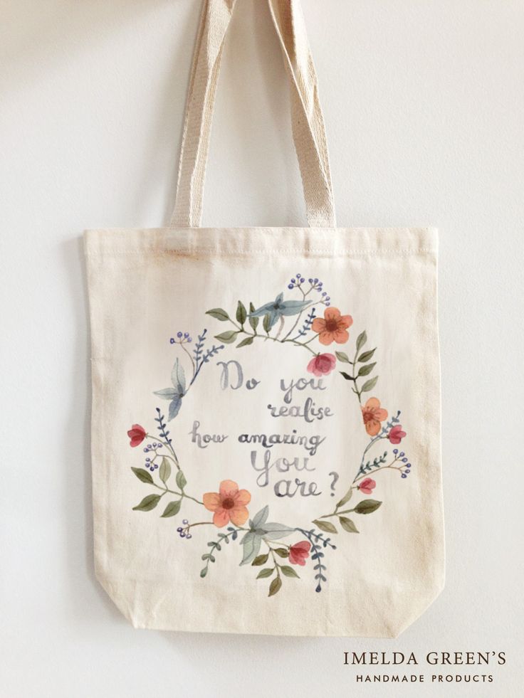 a tote bag hanging on a wall with the words, do you know what your amazing girl is?